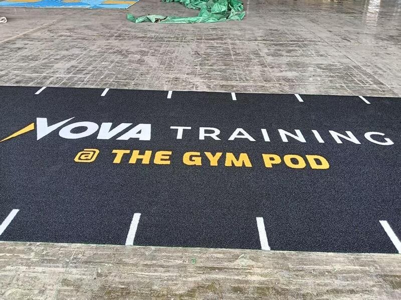cleaning and maintaining synthetic gym turf with a broom